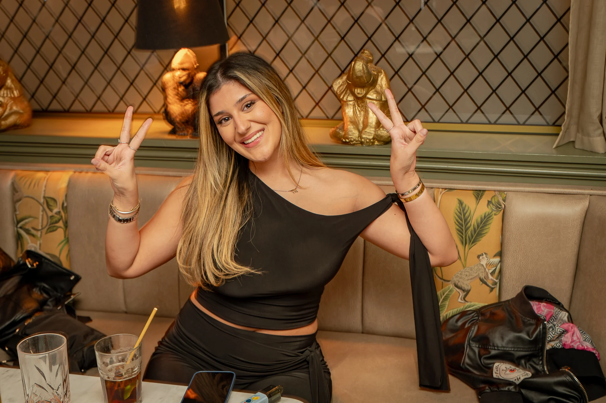 Drinks on the table in a jungle booth