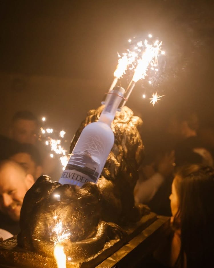 Champagne arriving with a lit sparkler